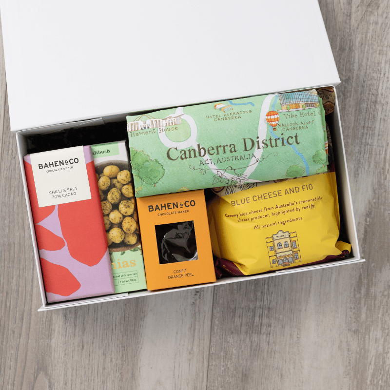 Gourmet popcorn, artisanal chocolate, hand-roasted macadamias, plus a watercolour-illustrated map cotton tea towel of the Canberra District and matching greeting card in a gift hamper with free delivery